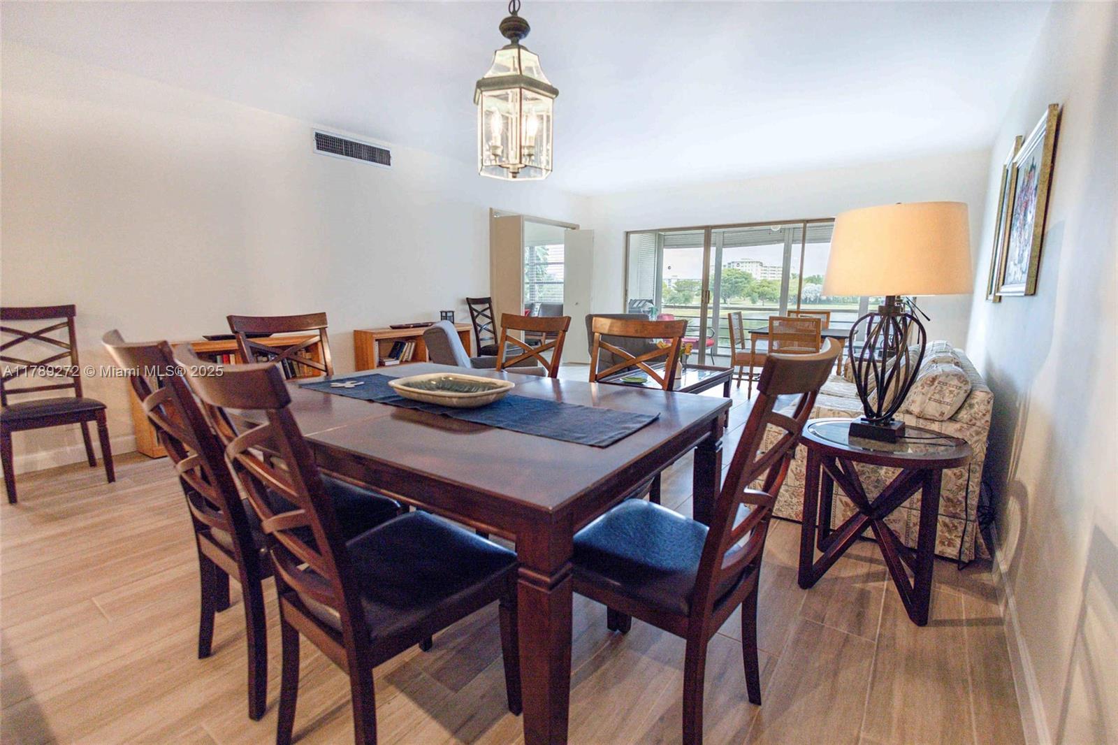 2751 North Palm Aire Drive, Unit 310 Pompano Beach, FL 33069 - Photo 3 of 70 a view of a dining room with furniture window and outside view
