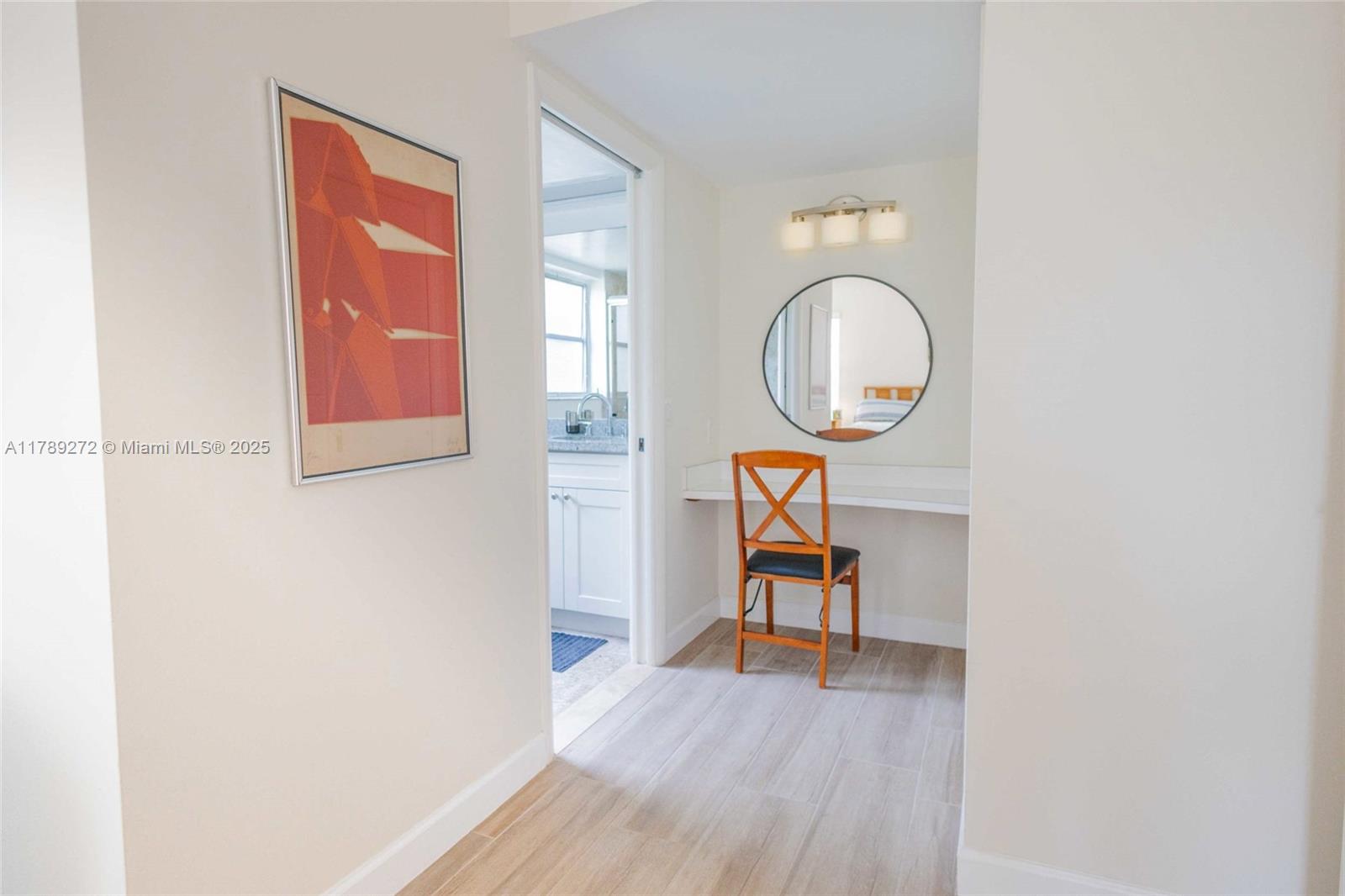 2751 North Palm Aire Drive, Unit 310 Pompano Beach, FL 33069 - Photo 31 of 70 a room with wooden floor and a window