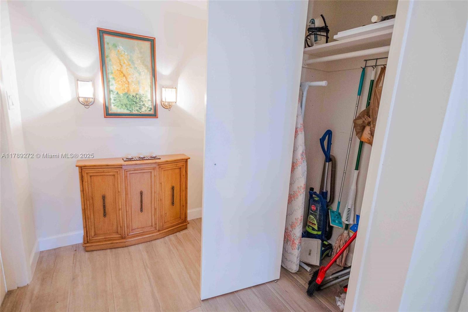 2751 North Palm Aire Drive, Unit 310 Pompano Beach, FL 33069 - Photo 37 of 70 a view of walk in closet with clothes and shoes