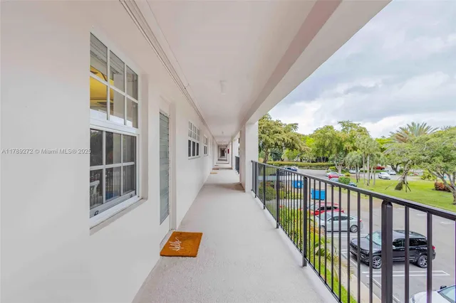 a view of a hallway with seating area