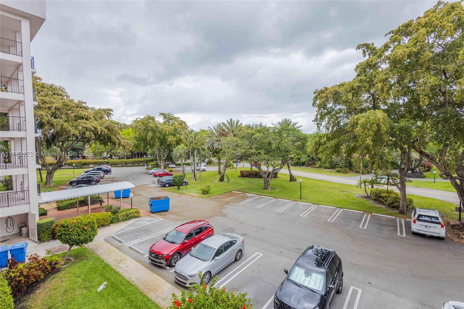 2751 North Palm Aire Drive, Unit 310 Pompano Beach, FL 33069 - Photo 46 of 70 a view of a swimming pool with a yard