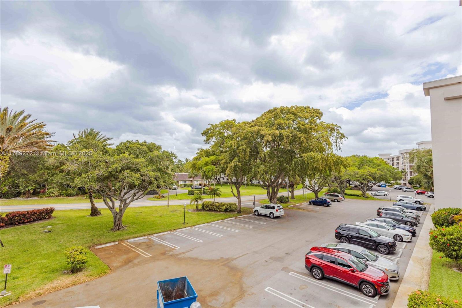 2751 North Palm Aire Drive, Unit 310 Pompano Beach, FL 33069 - Photo 49 of 70 a car parked on the side of the road