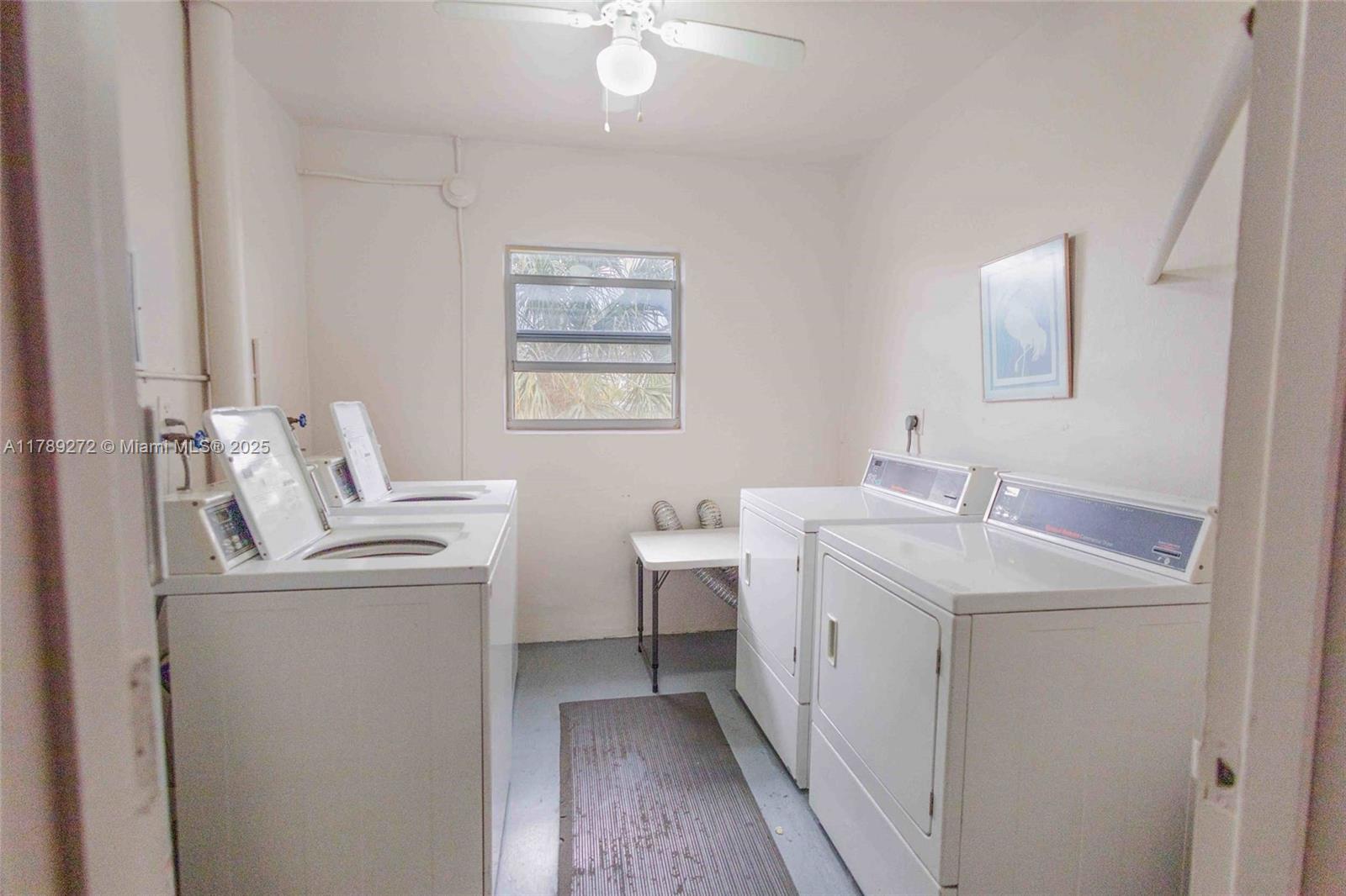 2751 North Palm Aire Drive, Unit 310 Pompano Beach, FL 33069 - Photo 52 of 70 a bathroom with a sink toilet and a mirror