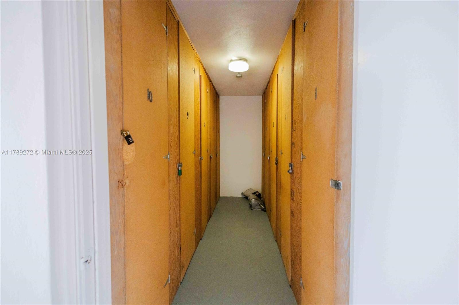 2751 North Palm Aire Drive, Unit 310 Pompano Beach, FL 33069 - Photo 53 of 70 a view of a bathroom with a shower and a door