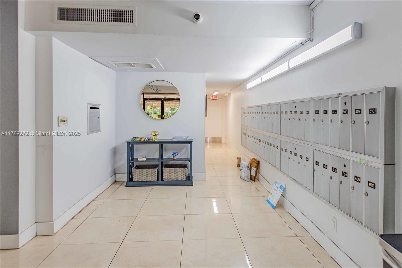 2751 North Palm Aire Drive, Unit 310 Pompano Beach, FL 33069 - Photo 55 of 70 a view of a hallway with seating area