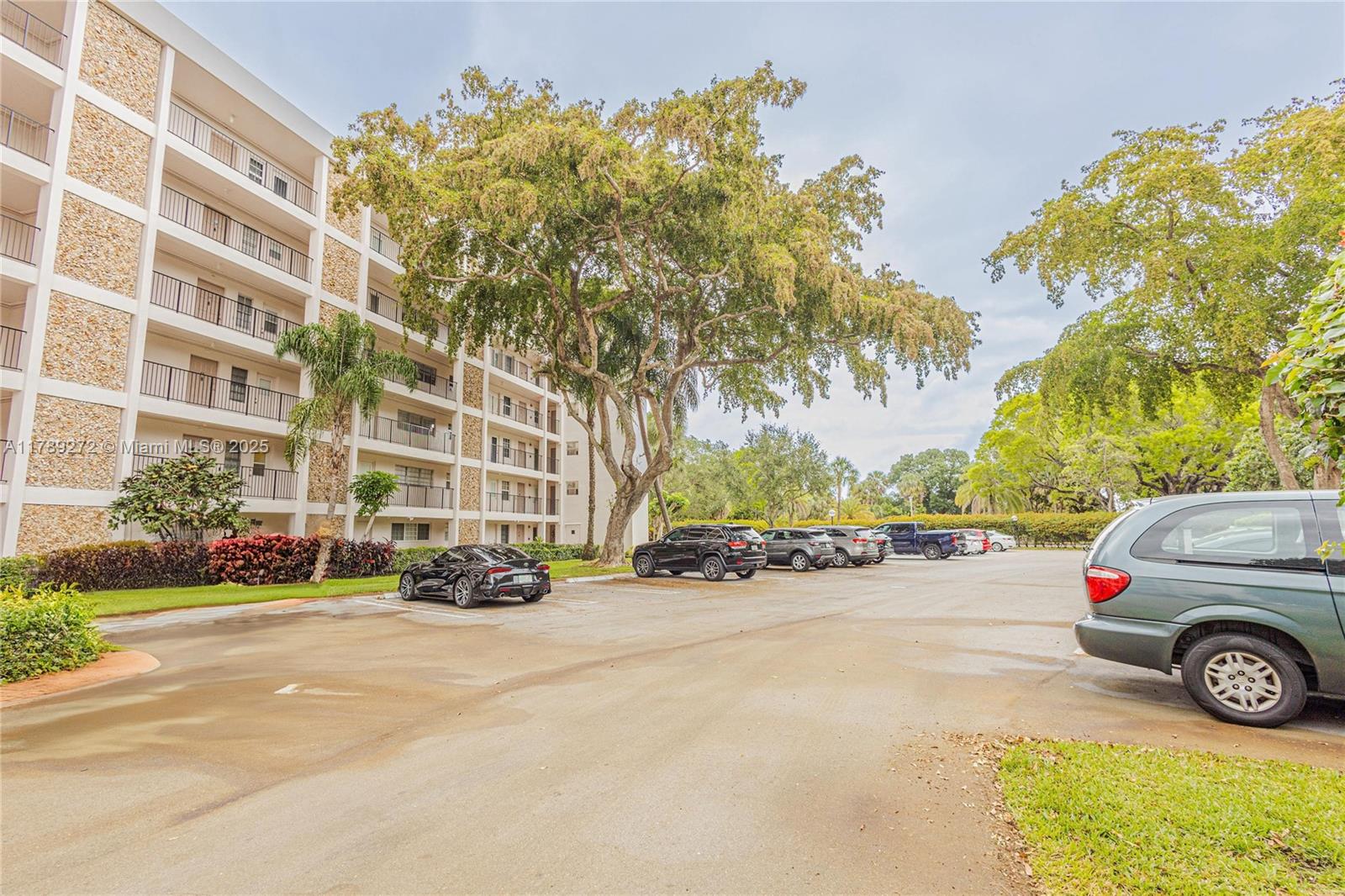2751 North Palm Aire Drive, Unit 310 Pompano Beach, FL 33069 - Photo 68 of 70 a view of a cars parked on the side of a street