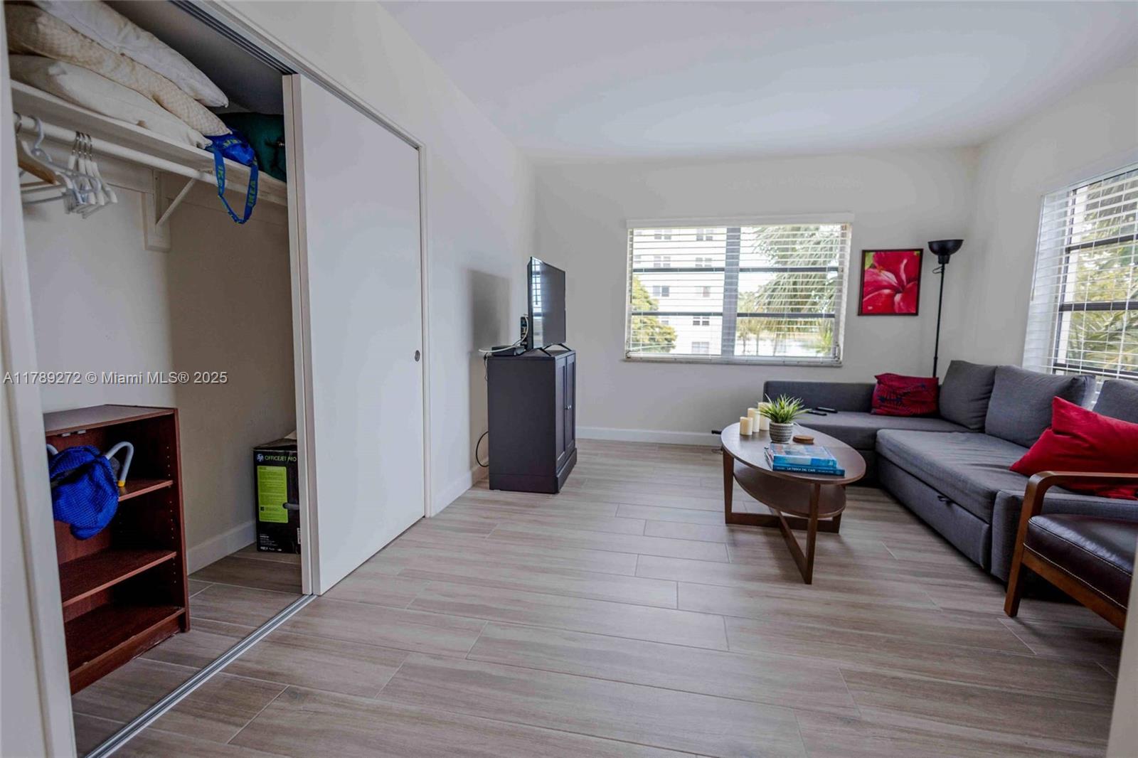 2751 North Palm Aire Drive, Unit 310 Pompano Beach, FL 33069 - Photo 10 of 70 a living room with furniture and a window