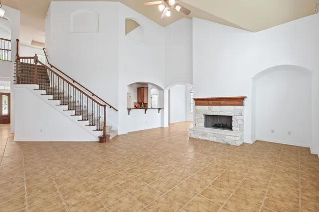 a view of empty room with fireplace