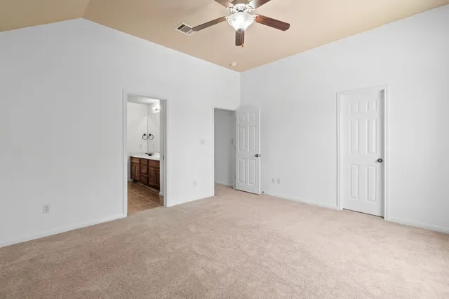 a view of a livingroom with a ceiling fan