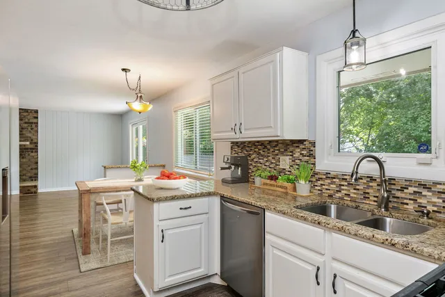 a kitchen that has a sink and cabinets