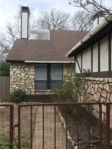 a side view of a house with a yard