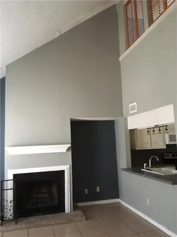 a view of a livingroom with furniture and a fireplace