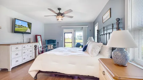 a bedroom with a bed and a dresser
