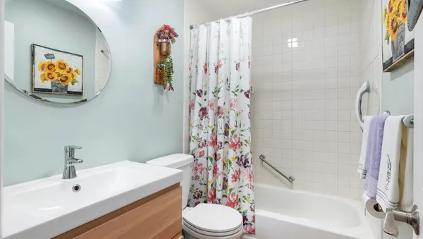 a bathroom with a sink a toilet and a bathtub