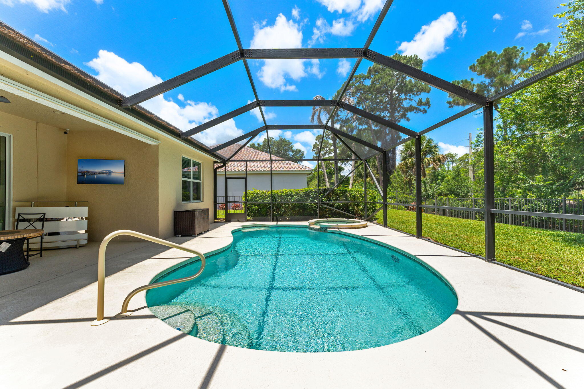 7657 Fieldstone Ranch Square Vero Beach, FL 32967 - Photo 37 of 52 a view of a swimming pool with a patio