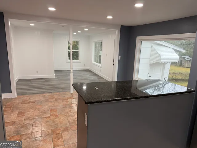 a view of a bathroom with a sink and mirror