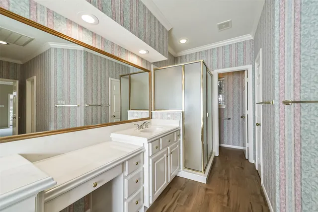 a bathroom with a sink a mirror and a shower