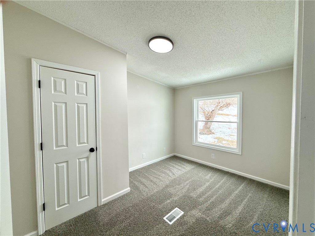 1500 Webster Road Glade Hill, VA 24092 - Photo 13 of 22 a view of an empty room with a window