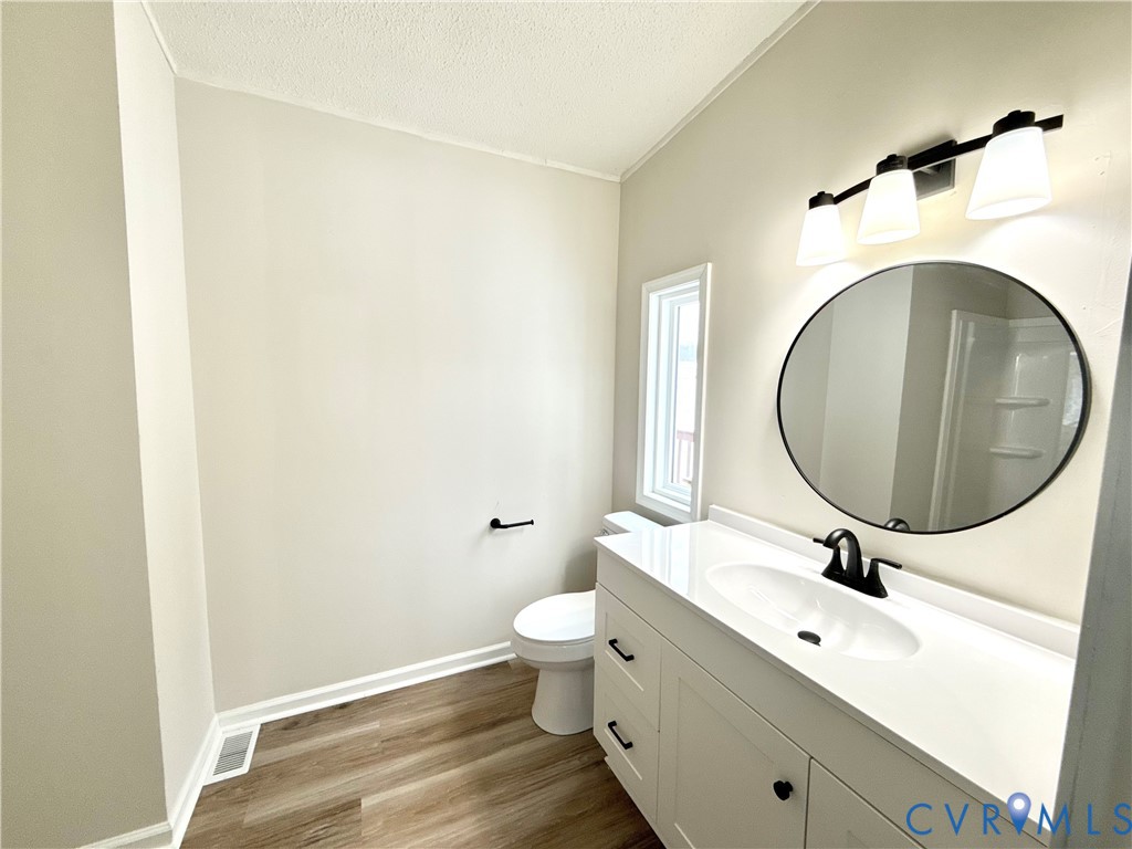 1500 Webster Road Glade Hill, VA 24092 - Photo 15 of 22 a bathroom with a sink and a mirror