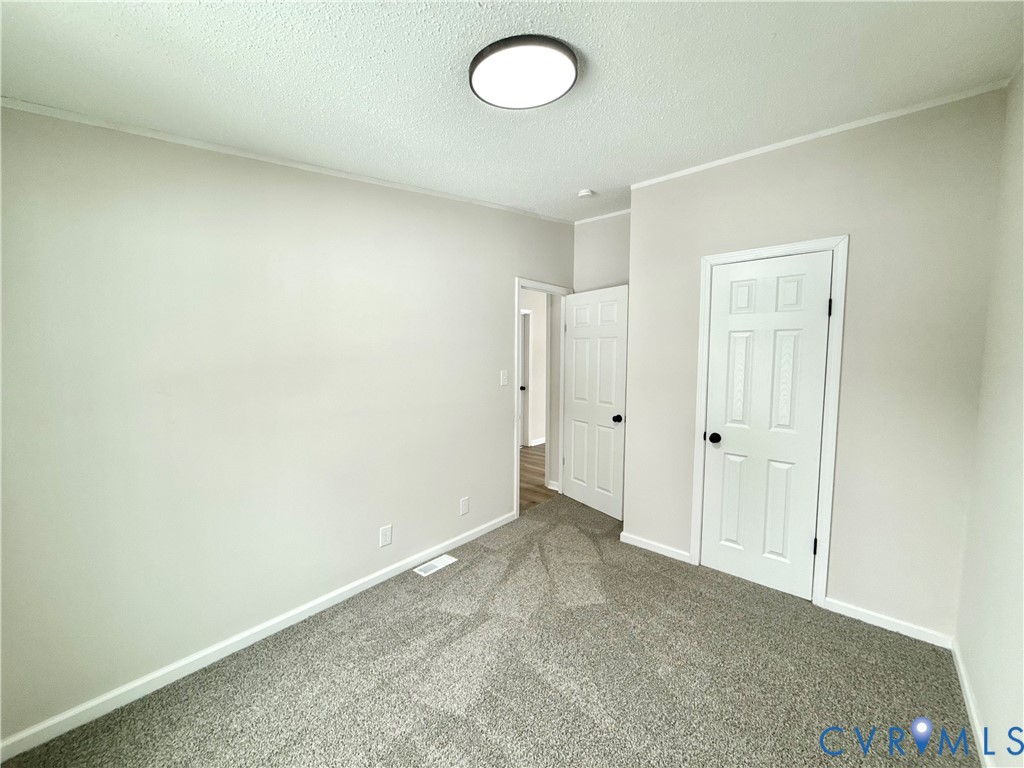 1500 Webster Road Glade Hill, VA 24092 - Photo 18 of 22 an empty room with a door