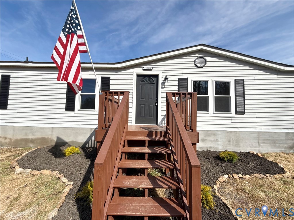 1500 Webster Road Glade Hill, VA 24092 - Photo 2 of 22 a front view of a house with a yard