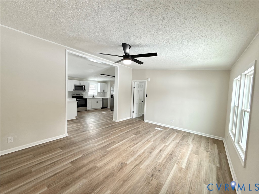 1500 Webster Road Glade Hill, VA 24092 - Photo 3 of 22 wooden floor in an empty room with a window