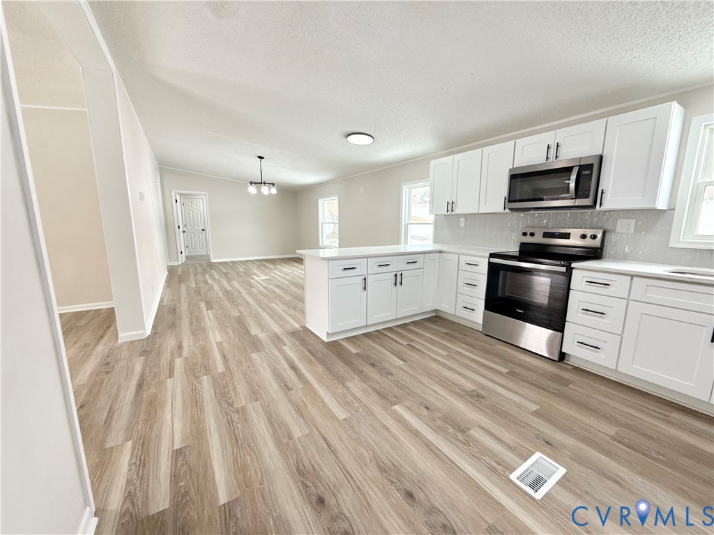 1500 Webster Road Glade Hill, VA 24092 - Photo 6 of 22 a large kitchen with cabinets