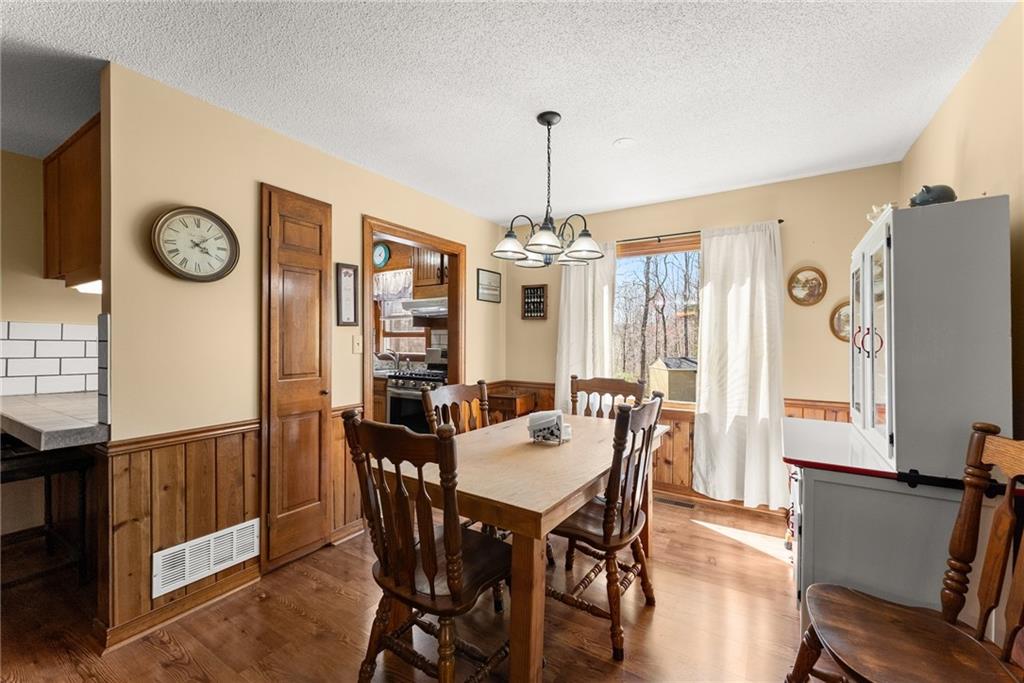 312 Ashley Brook Drive Lula, GA 30554 - Photo 17 of 62 a view of a dining room with furniture window and wooden floor