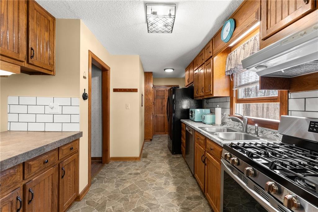 312 Ashley Brook Drive Lula, GA 30554 - Photo 20 of 62 a kitchen with stainless steel appliances granite countertop a stove and a sink
