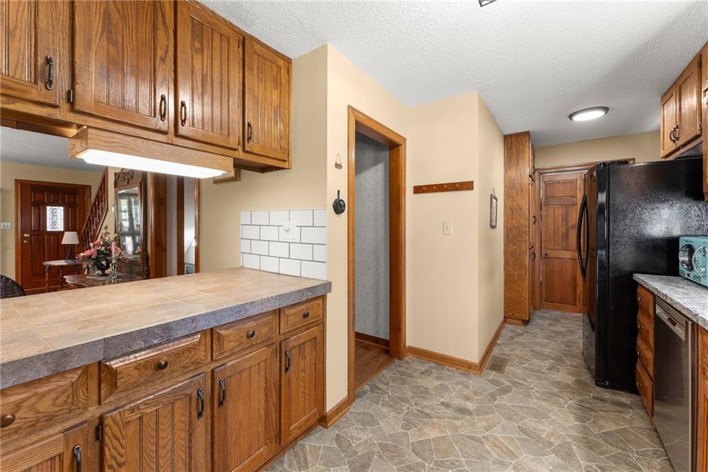 312 Ashley Brook Drive Lula, GA 30554 - Photo 21 of 62 a kitchen with cabinets and stainless steel appliances