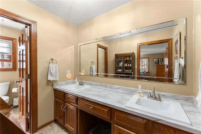 a bed room with a bed and a chair