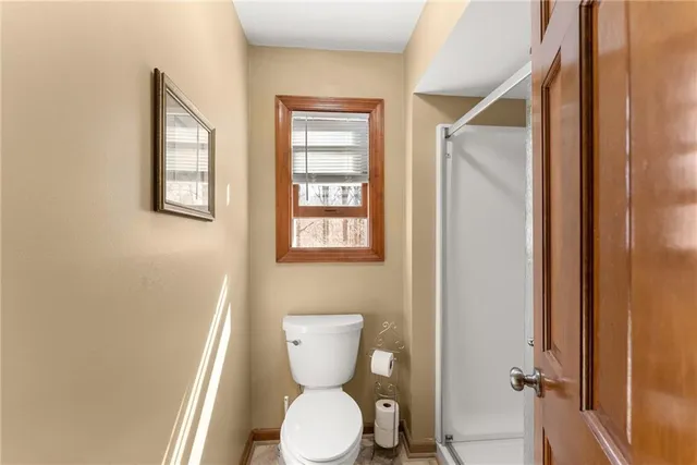 a bedroom with a bed and flat screen tv