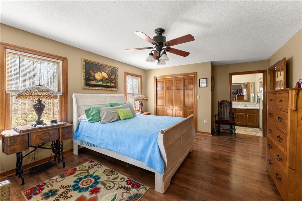 312 Ashley Brook Drive Lula, GA 30554 - Photo 26 of 62 a bed room with a bed and a chair