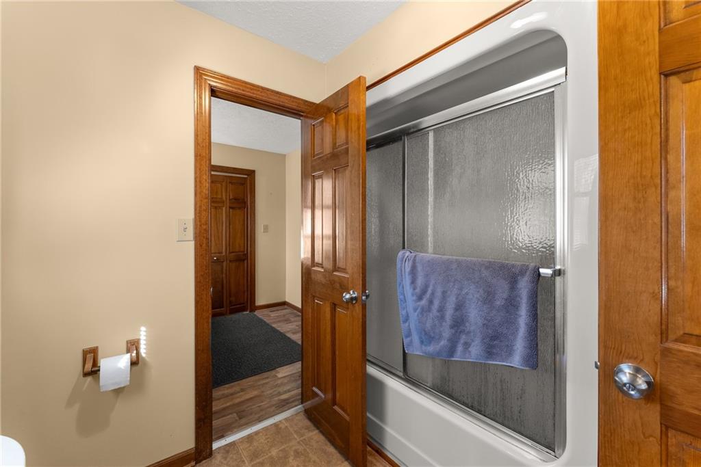 312 Ashley Brook Drive Lula, GA 30554 - Photo 32 of 62 a bathroom with a glass door shower and a sink