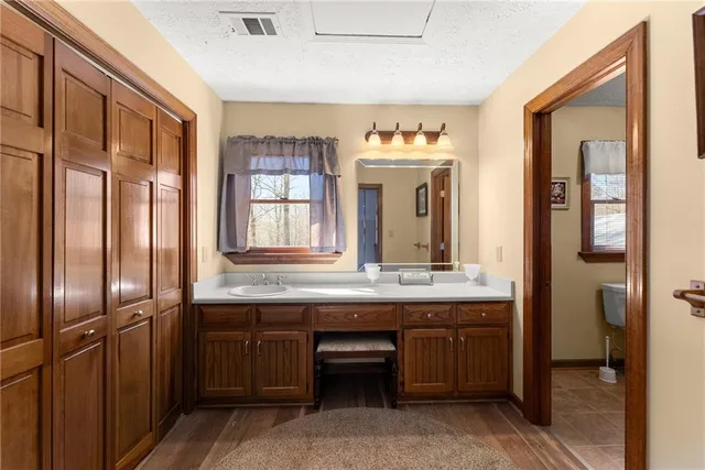 a kitchen that has a sink and a stove in it