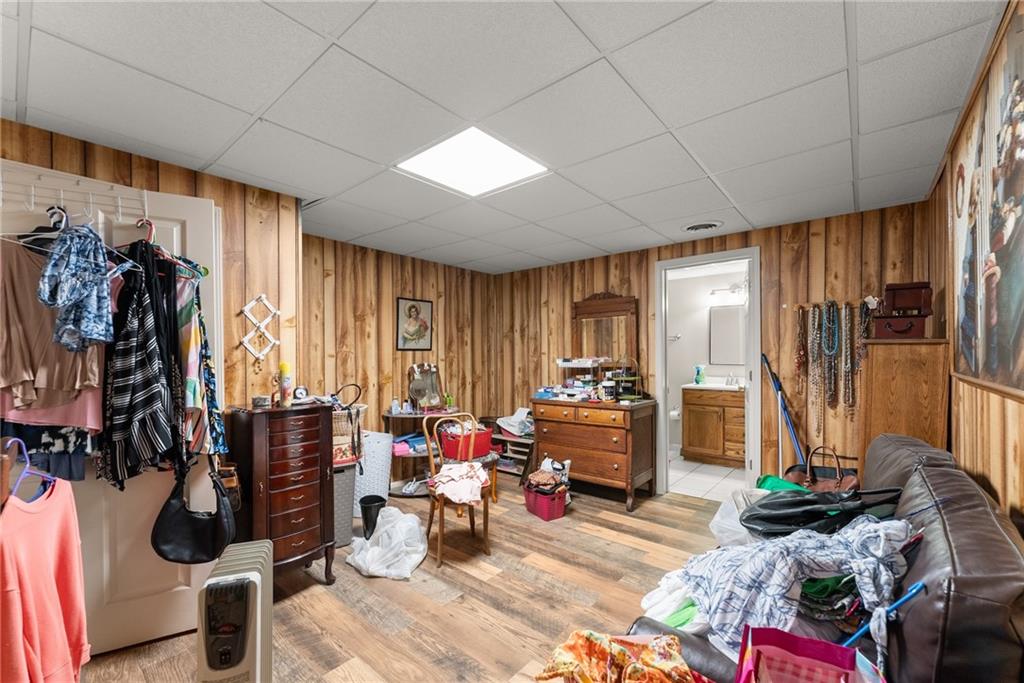312 Ashley Brook Drive Lula, GA 30554 - Photo 39 of 62 a living room with furniture and a floor to ceiling window