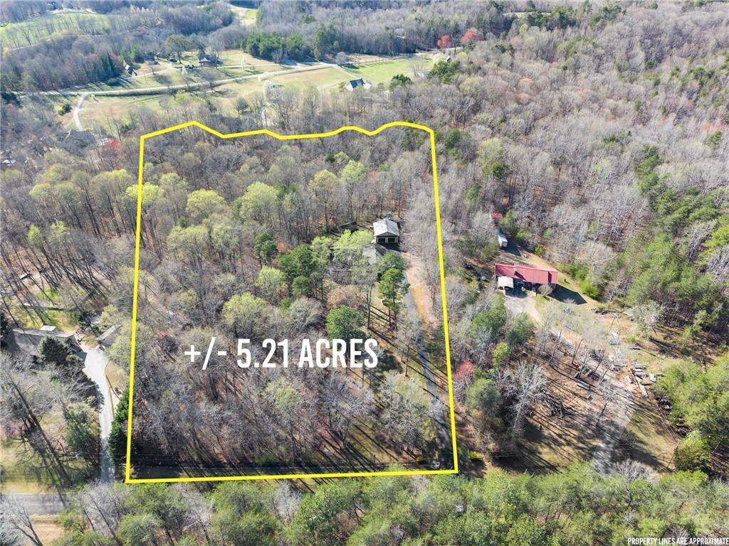 312 Ashley Brook Drive Lula, GA 30554 - Photo 4 of 62 a signage on a wall with a tree in the background