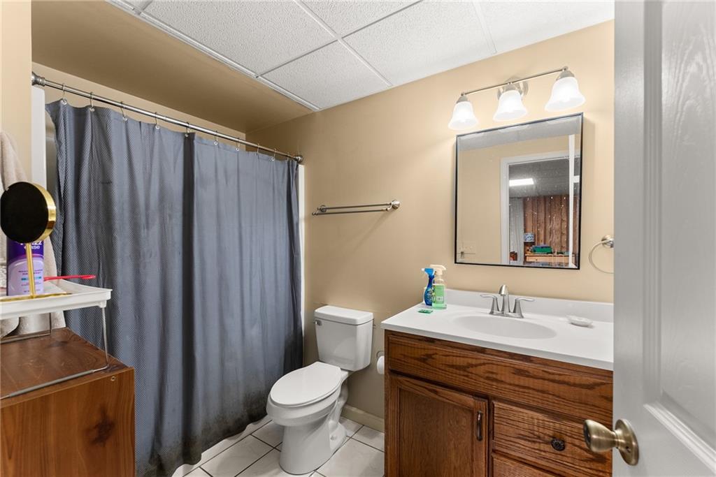 312 Ashley Brook Drive Lula, GA 30554 - Photo 41 of 62 a bathroom with a sink a toilet and mirror
