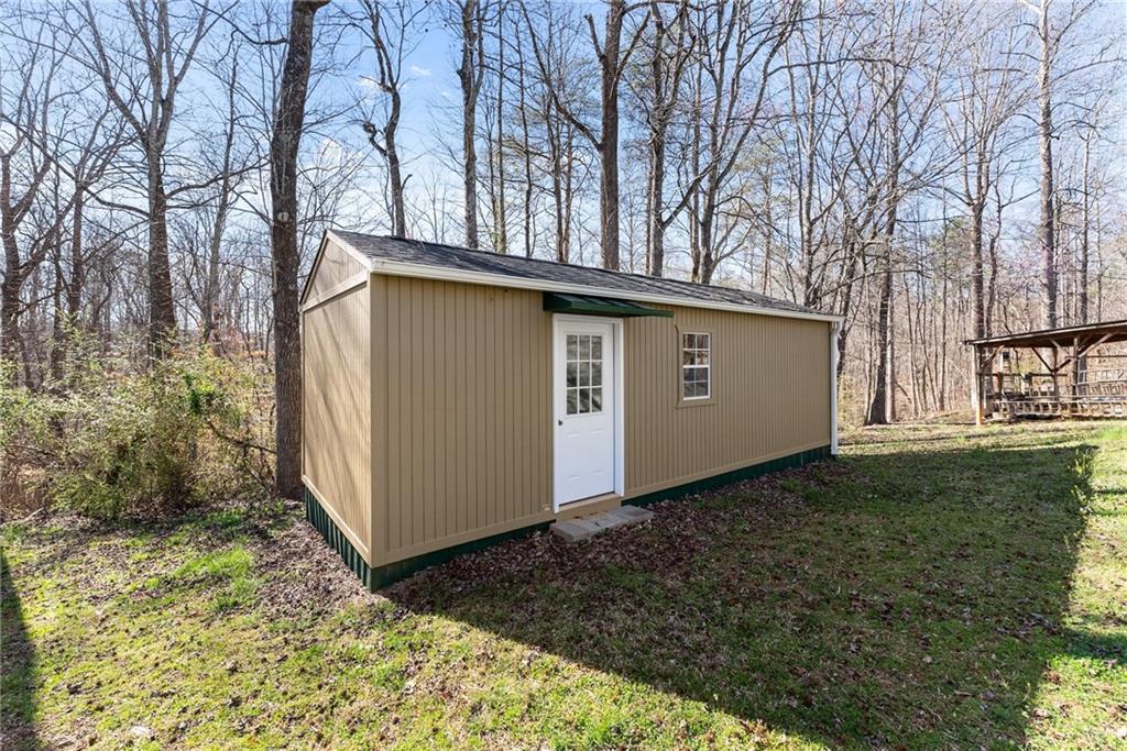 312 Ashley Brook Drive Lula, GA 30554 - Photo 44 of 62 a backyard of a house with lots of green space