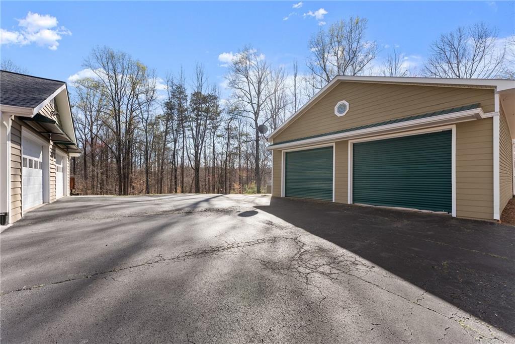 312 Ashley Brook Drive Lula, GA 30554 - Photo 48 of 62 a front view of a house with a yard and garage
