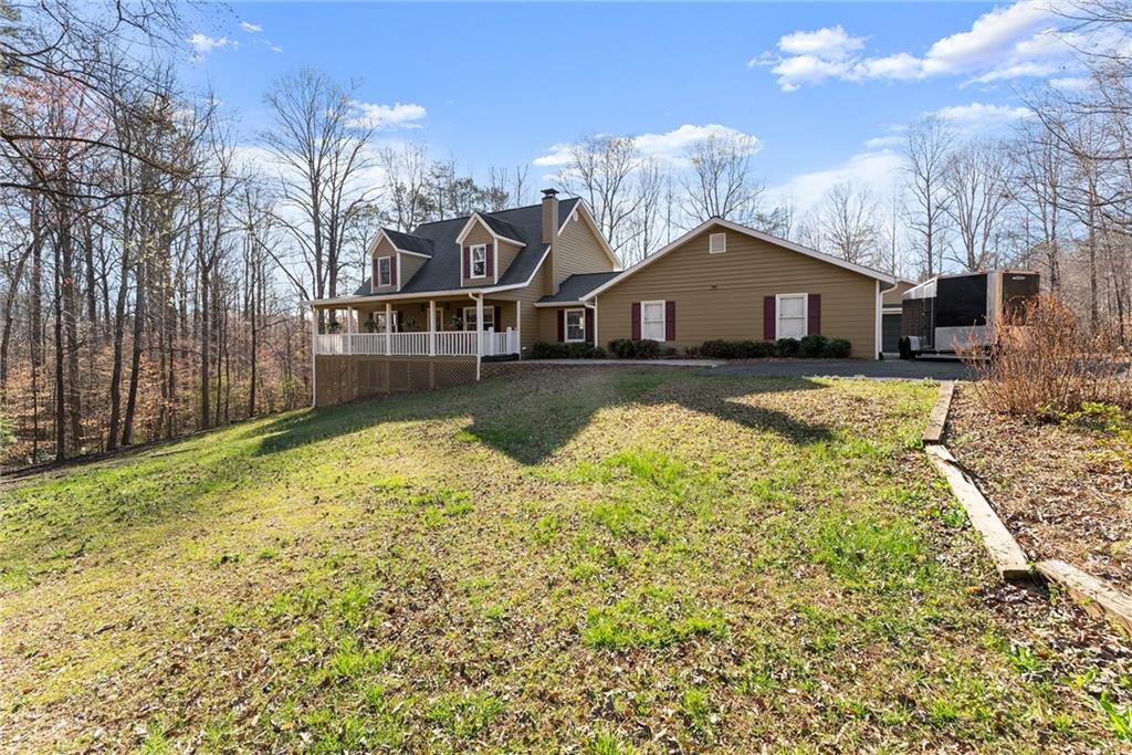 312 Ashley Brook Drive Lula, GA 30554 - Photo 56 of 62 a view of a house with a yard covered with snow in front of house
