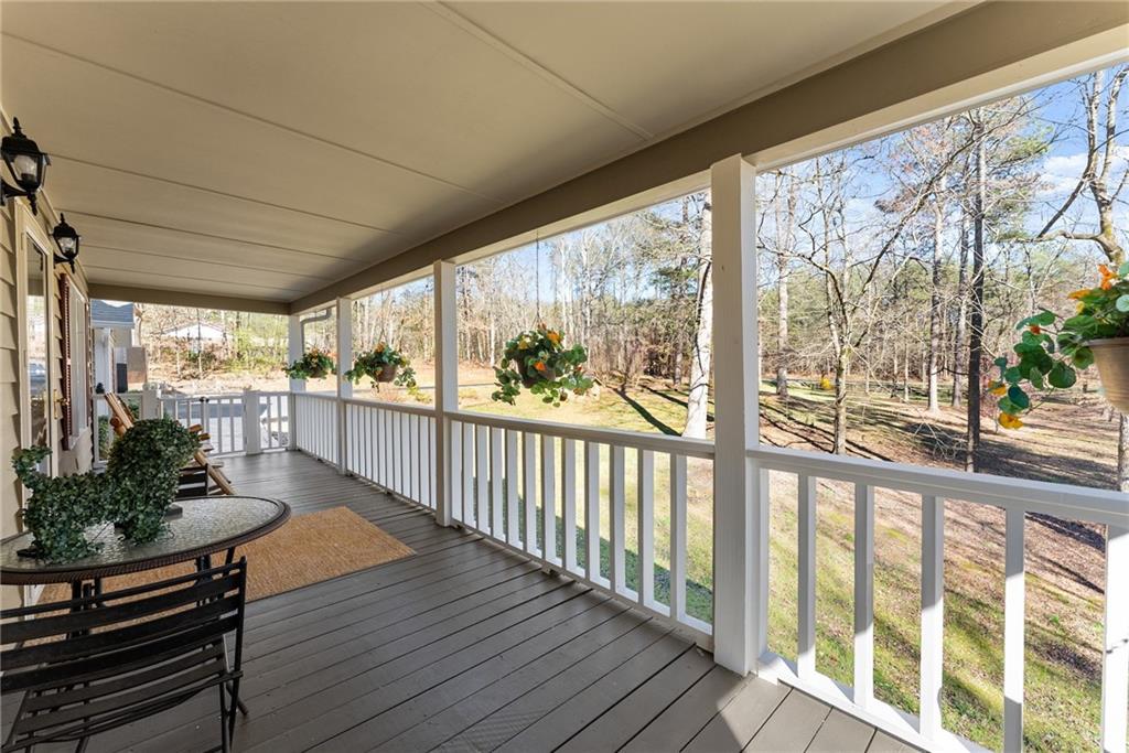 312 Ashley Brook Drive Lula, GA 30554 - Photo 10 of 62 a view of a porch with wooden floor