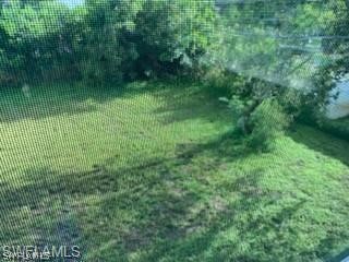 8313 Matanzas Road Fort Myers, FL 33967 - Photo 17 of 17 a view of a garden from a balcony