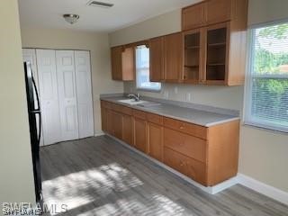 8313 Matanzas Road Fort Myers, FL 33967 - Photo 3 of 17 a kitchen with stainless steel appliances granite countertop a refrigerator and a sink