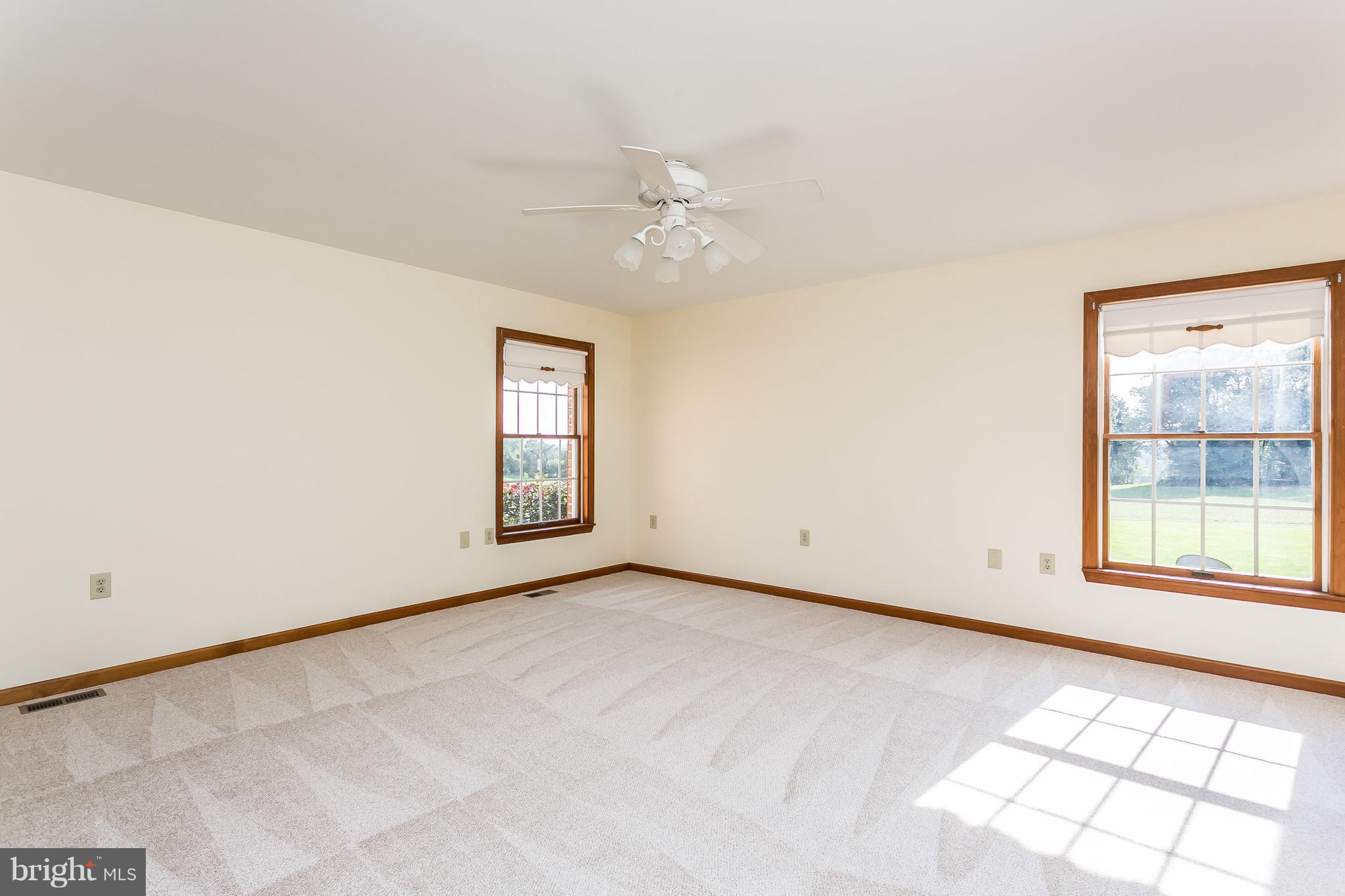 1925 Brown Road Finksburg, MD 21048 - Photo 14 of 30 an empty room with windows and ceiling fan view