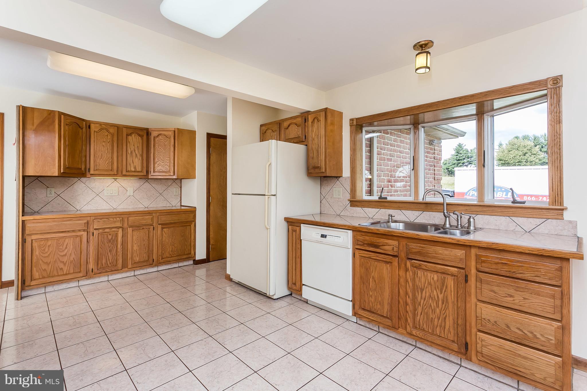 1925 Brown Road Finksburg, MD 21048 - Photo 21 of 30 a kitchen with a sink window and cabinets