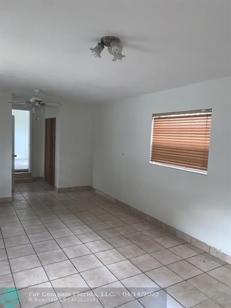 664 Southeast 8th Place Hialeah, FL 33010 - Photo 13 of 16 a view of an empty room with a window