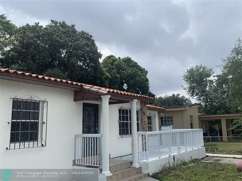 664 Southeast 8th Place Hialeah, FL 33010 - Photo 3 of 16 front view of a house with a tree