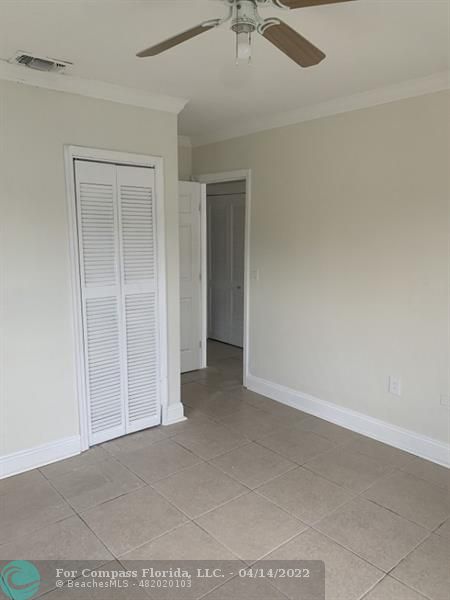 664 Southeast 8th Place Hialeah, FL 33010 - Photo 5 of 16 an empty room with fan