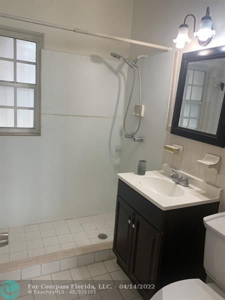 664 Southeast 8th Place Hialeah, FL 33010 - Photo 6 of 16 a bathroom with a sink toilet and shower